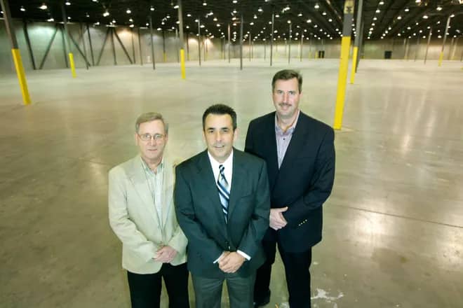 Young Capital starters standing in new warehouse